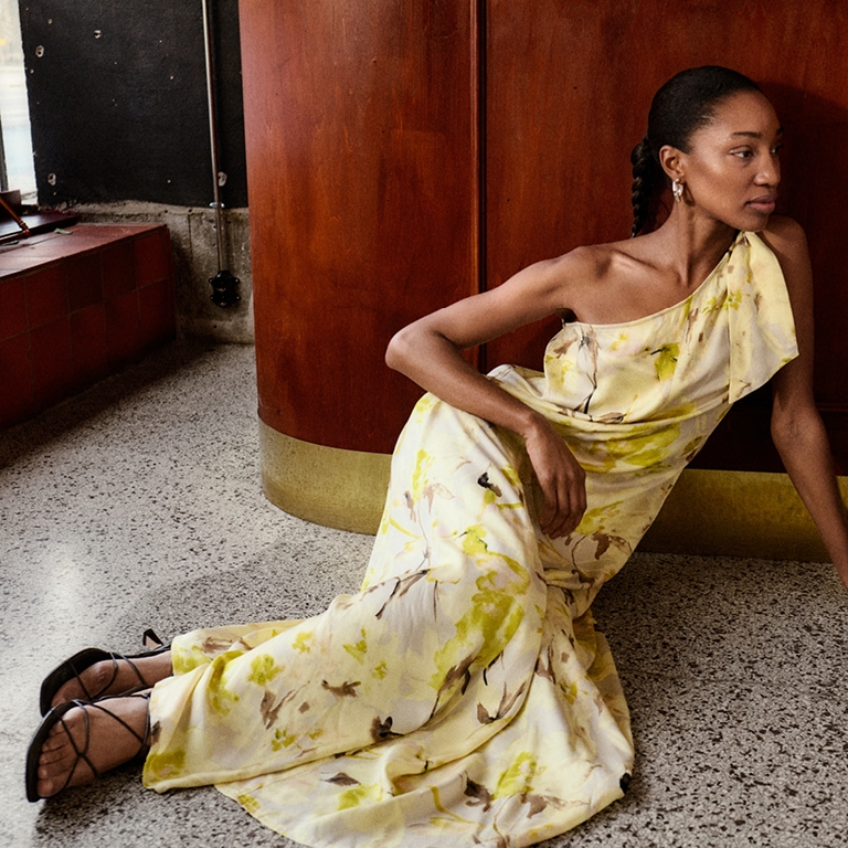 Woman in floral yellow dress