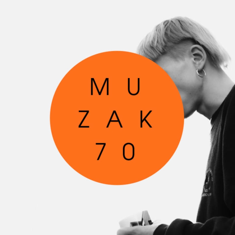 Blond man with an earring. The image is black and white.