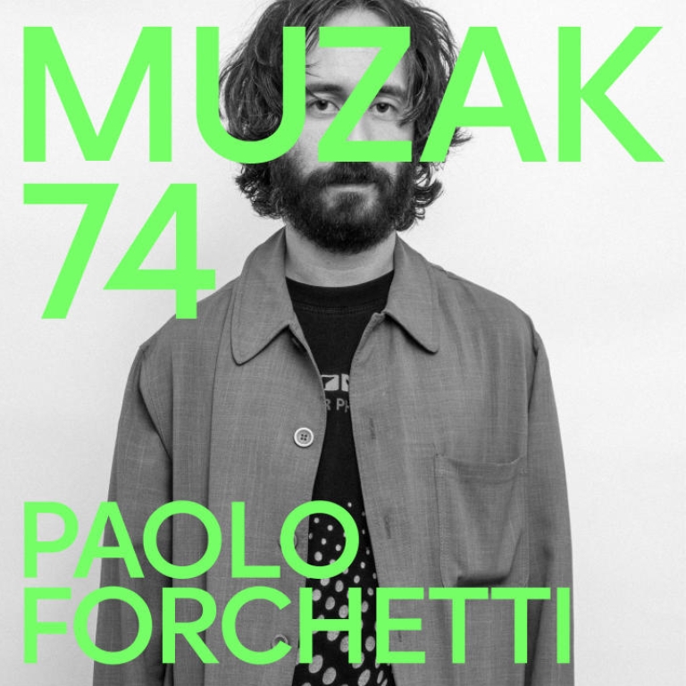 Man with a beard, centered in the black and white image.