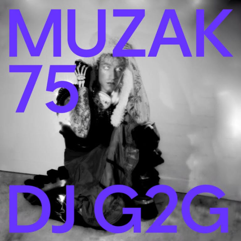 Man sitting on his knees on the floor with a skeletal hand.