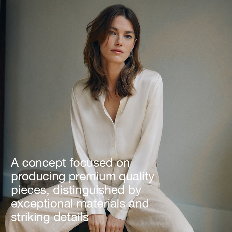 woman in a white silk shirt