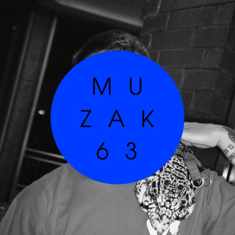 Picture in black and white with a blue circle in the middle